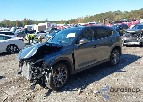 2021 Mazda Cx-5 Signature z USA, uszkodzony, nr VIN JM3KFBEY6M0449522